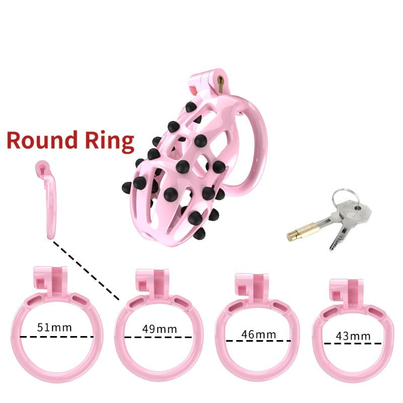 Pink Chastity Cage with 5 Size Penis Rings and Removable Silicone Spikes - ChastityBondage